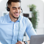 A call center employee speaks into a telephone headset. 